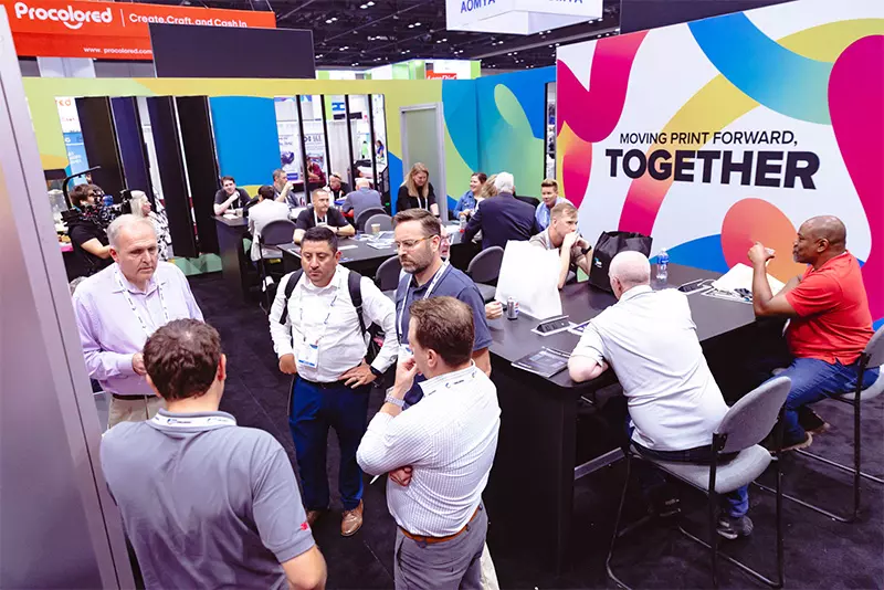 People in discussion at the expo.