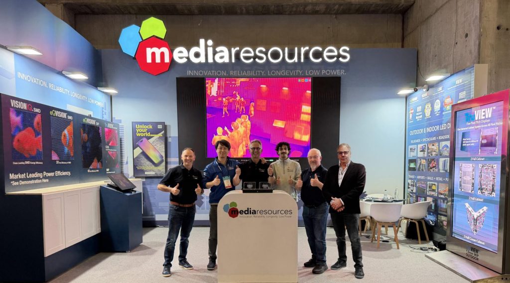 Employees at a Media Resources booth. 