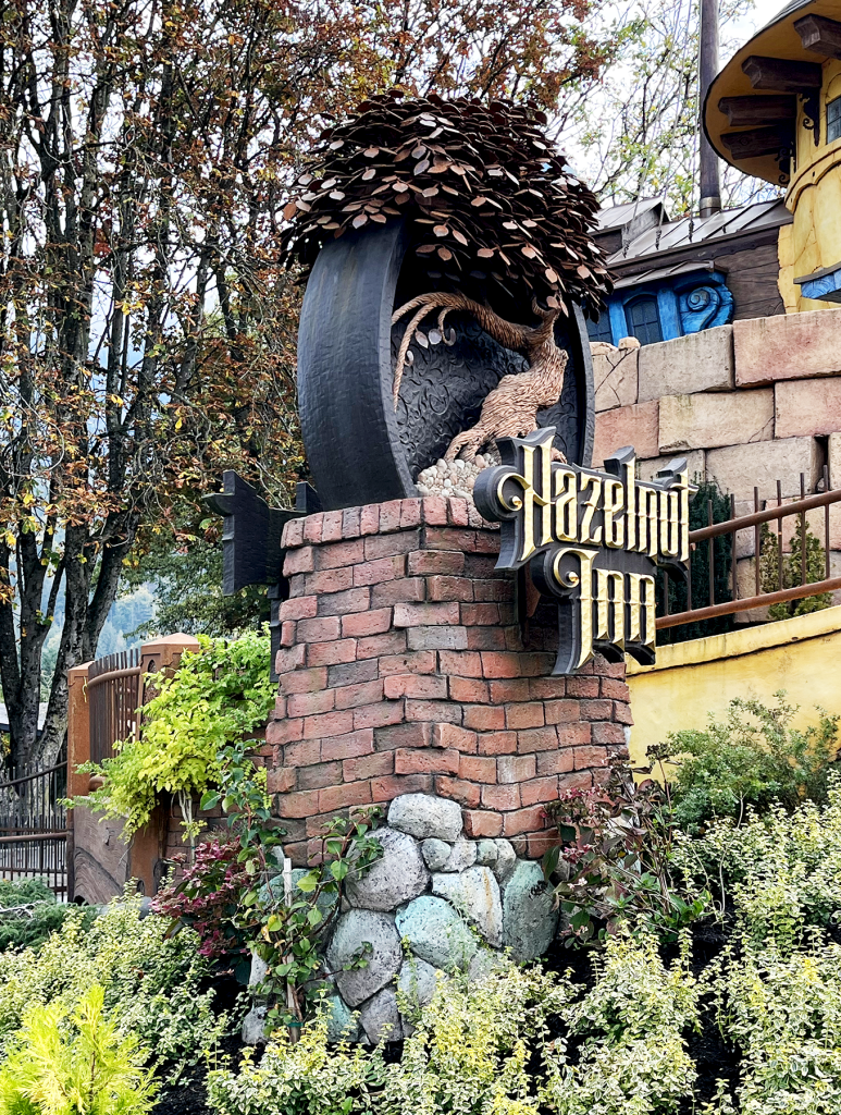 Hazelnut Inn entrance sign on a brick pillar.
