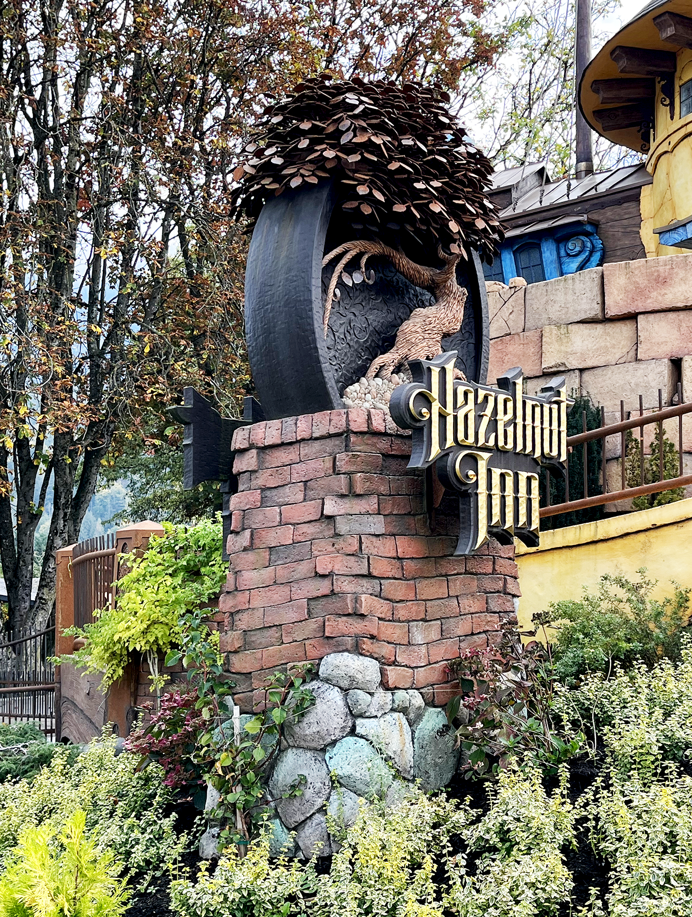 Hazelnut Inn entrance sign on a brick pillar.
