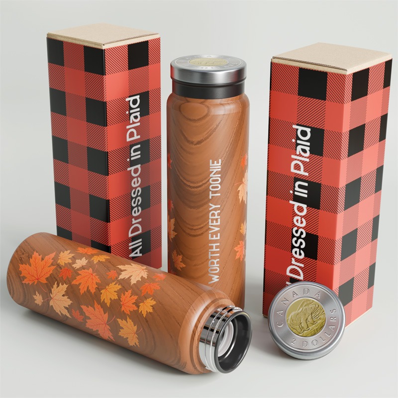 Two wood-textured insulated bottles with autumn leaf designs and plaid-patterned boxes labeled "All Dressed in Plaid."