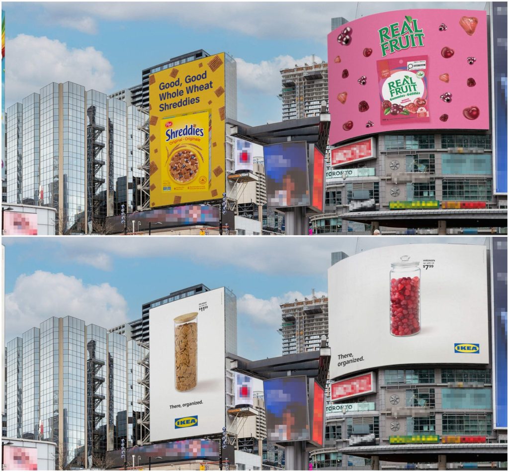 Split-screen city billboards comparing cereal and candy ads with minimalist IKEA “There, organized” jar advertisements on modern downtown skyscrapers under a cloudy blue sky.