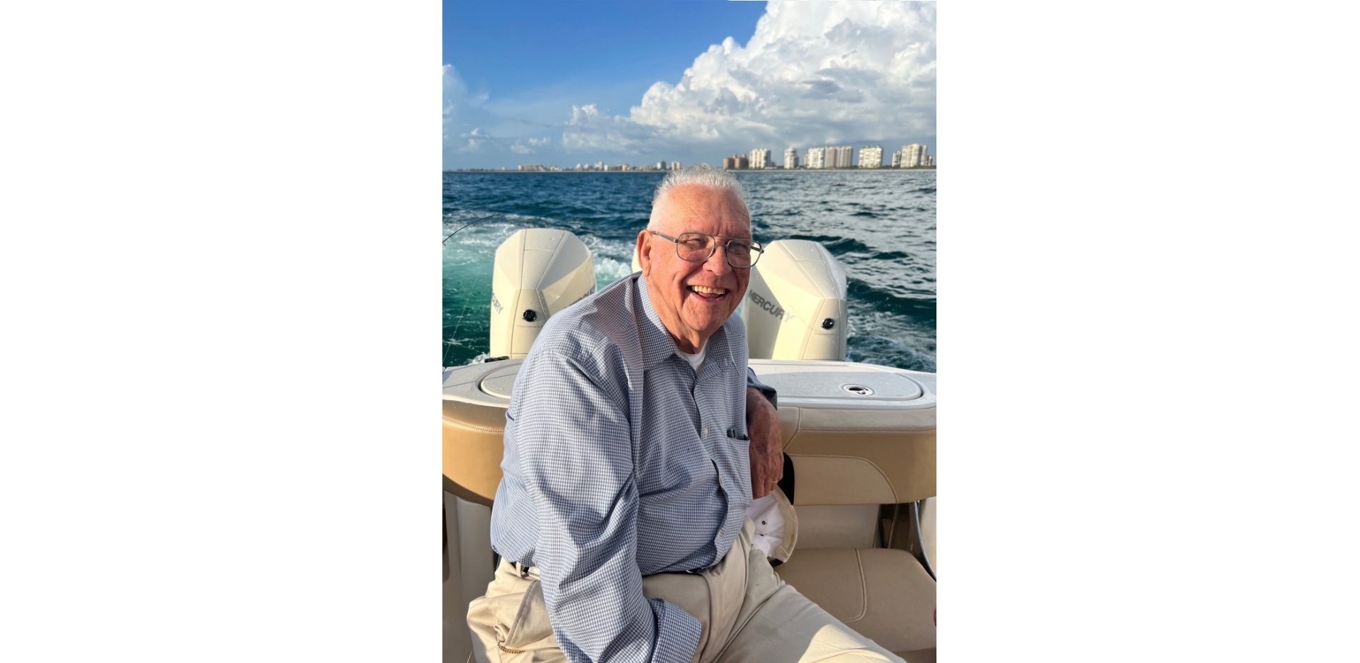 An image of Jim Weinel on a boat with a water body in the background.