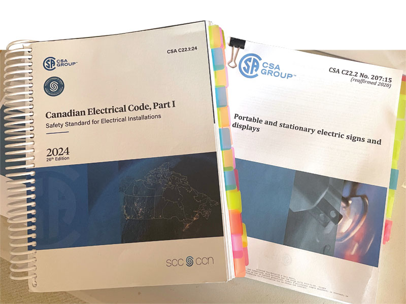 CSA Group’s resources: The Canadian Electrical Code Part 1 and Portable and stationary electric signs and displays.