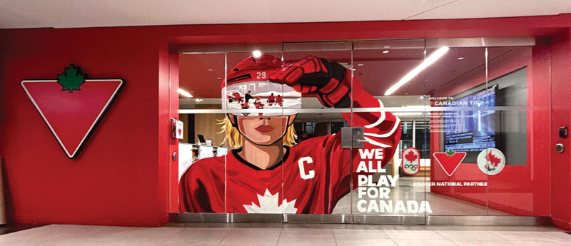 A window graphic shows a Team Canada hockey player with a maple leaf logo and the words "We All Play for Canada."